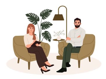 Two people having a conversation in a cozy setting.