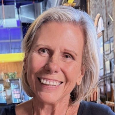 Picture of Laurie looking slightly left and smiling
