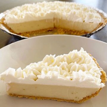 Slice of creamy pie topped with whipped cream on a plate.