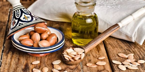 An organic oil bottle on a wooden table