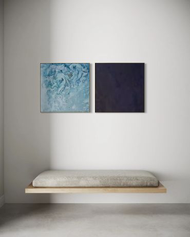 Minimalist bench with two abstract paintings above.