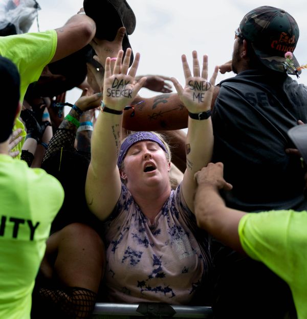 Person with hands raised, text on hands reads 'DAY SEEKER' and 'SAVED ME'.