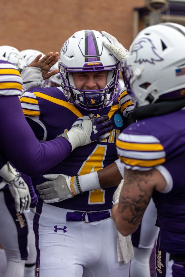 Football players celebrating on the field.