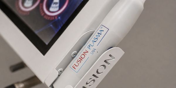 Close-up of a medical device labeled Fusion Plasma, USA.