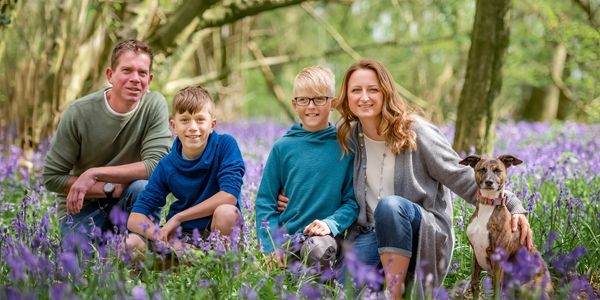 Family of four with a dog