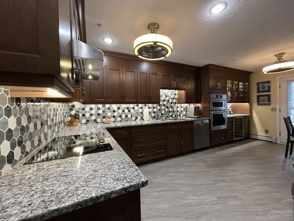 Modern kitchen  renovation in Aspen Woods, Calgary by Orion Construction & Renovations