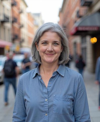 A portrait of Karyn in a charming city background.