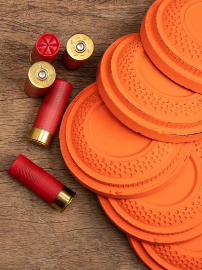 Photograph of sporting clays lying next to sporting shells