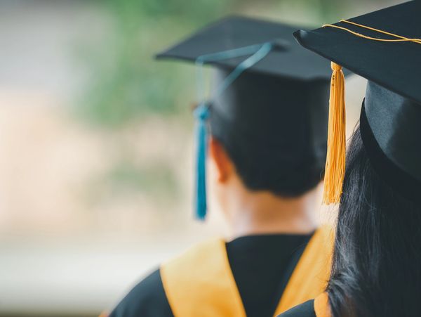 Photo of a student wearing a cap and gown 