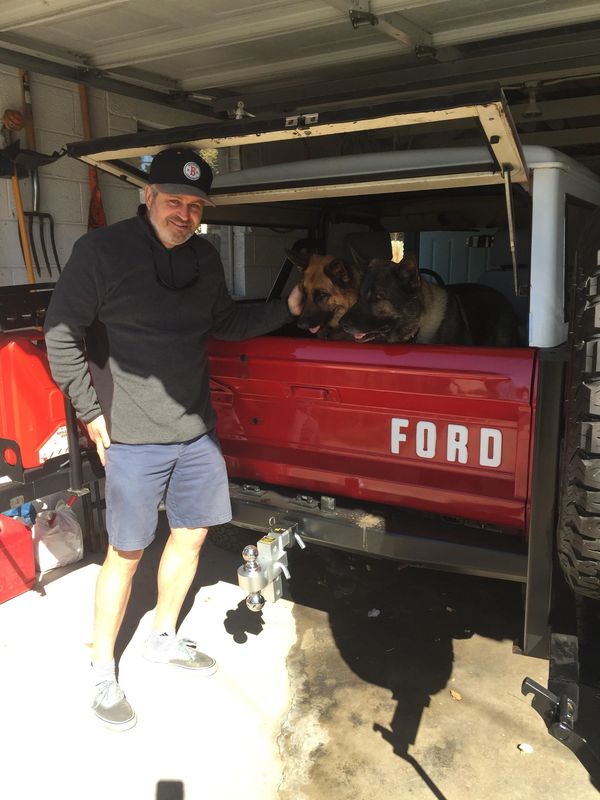 Dogs and bronco getting ready to go for a hike.