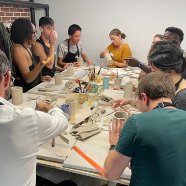 Group of people hand building with clay at Community Clay in RiNo, Denver, CO