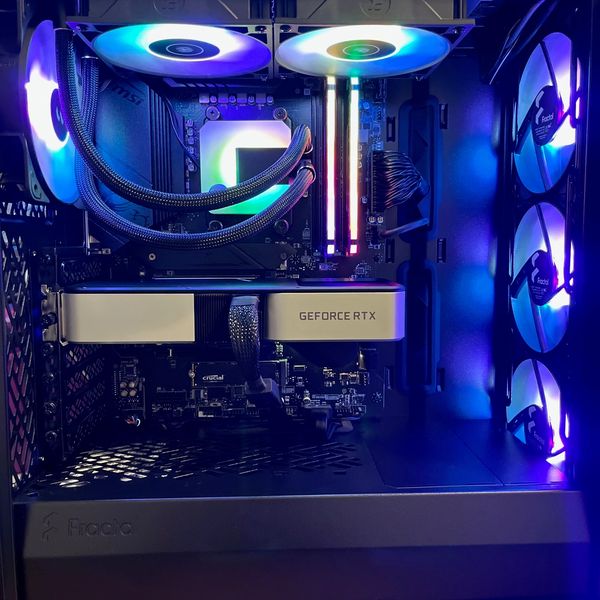 RGB-lit gaming PC interior with GeForce RTX graphics card.