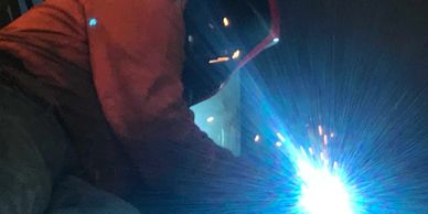 a fabricator welding