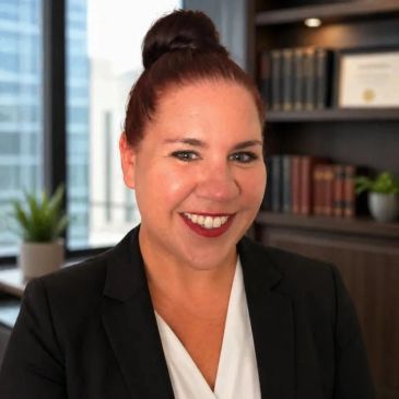Professional woman smiling in office setting.