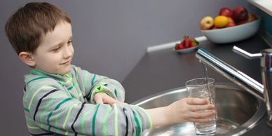 CHILD DRINKING FILTERED WATER