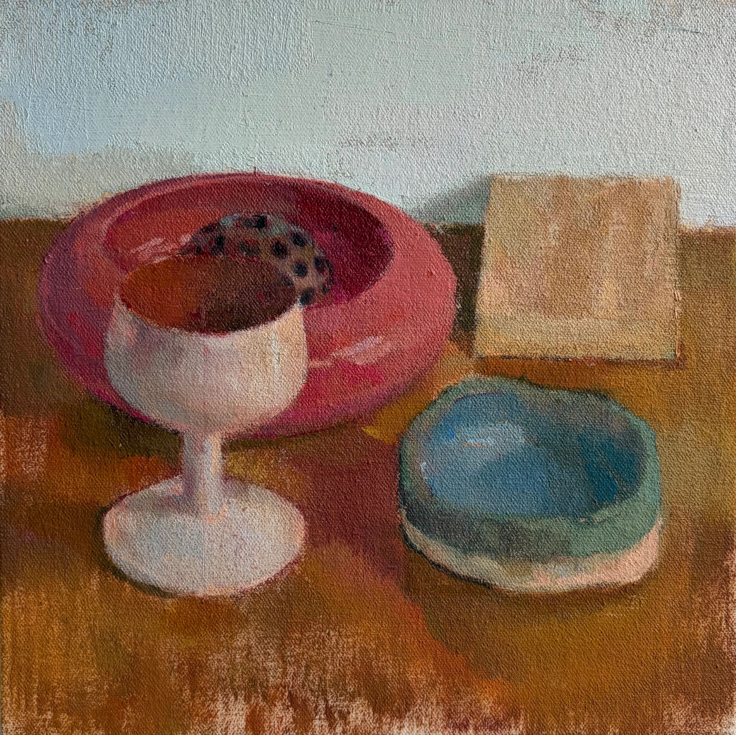 Still life painting with cups, cookie, and plates.