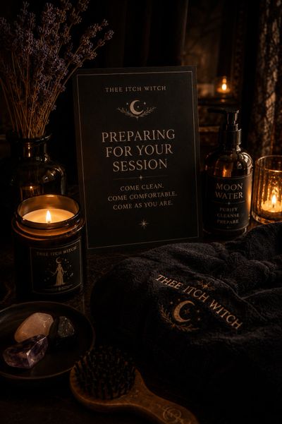 Cozy witchcraft session setup with candles, crystals, and cleansing water.