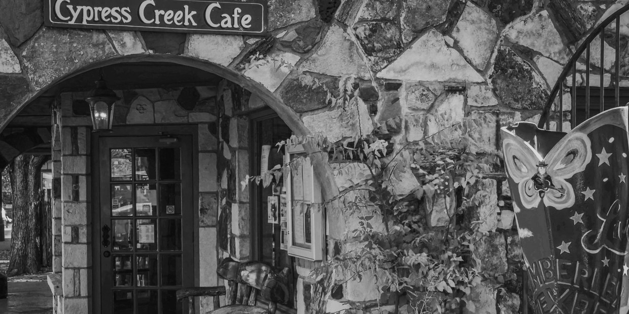 Stone facade of Cypress Creek Cafe with wooden chairs and butterfly artwork pre fire. 
KWB

https://keepwimberleybeautiful.org/history-of-kwb
Gold-Star Community Beautification in Wimberley, Texas: Join Us Today!
Join Keep Wimberley Beautiful to enhance community cleanup efforts and Wimberley beautification through environmental initiatives and KWB volunteer efforts in the historically beautiful Hill Country community of Wimberley, Texas.
