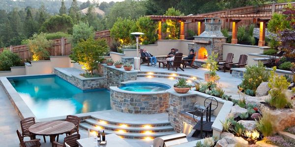 Beautiful backyard oasis with pool, hot tub and custom landscaping. 