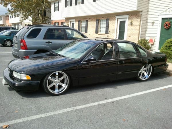 1995 bagged Impala SS. tucking 22" wheels in the rear