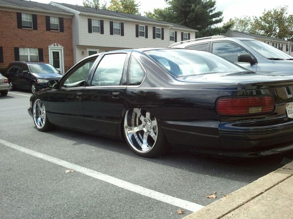 1995 bagged Impala SS. tucking 22" wheels in the rear