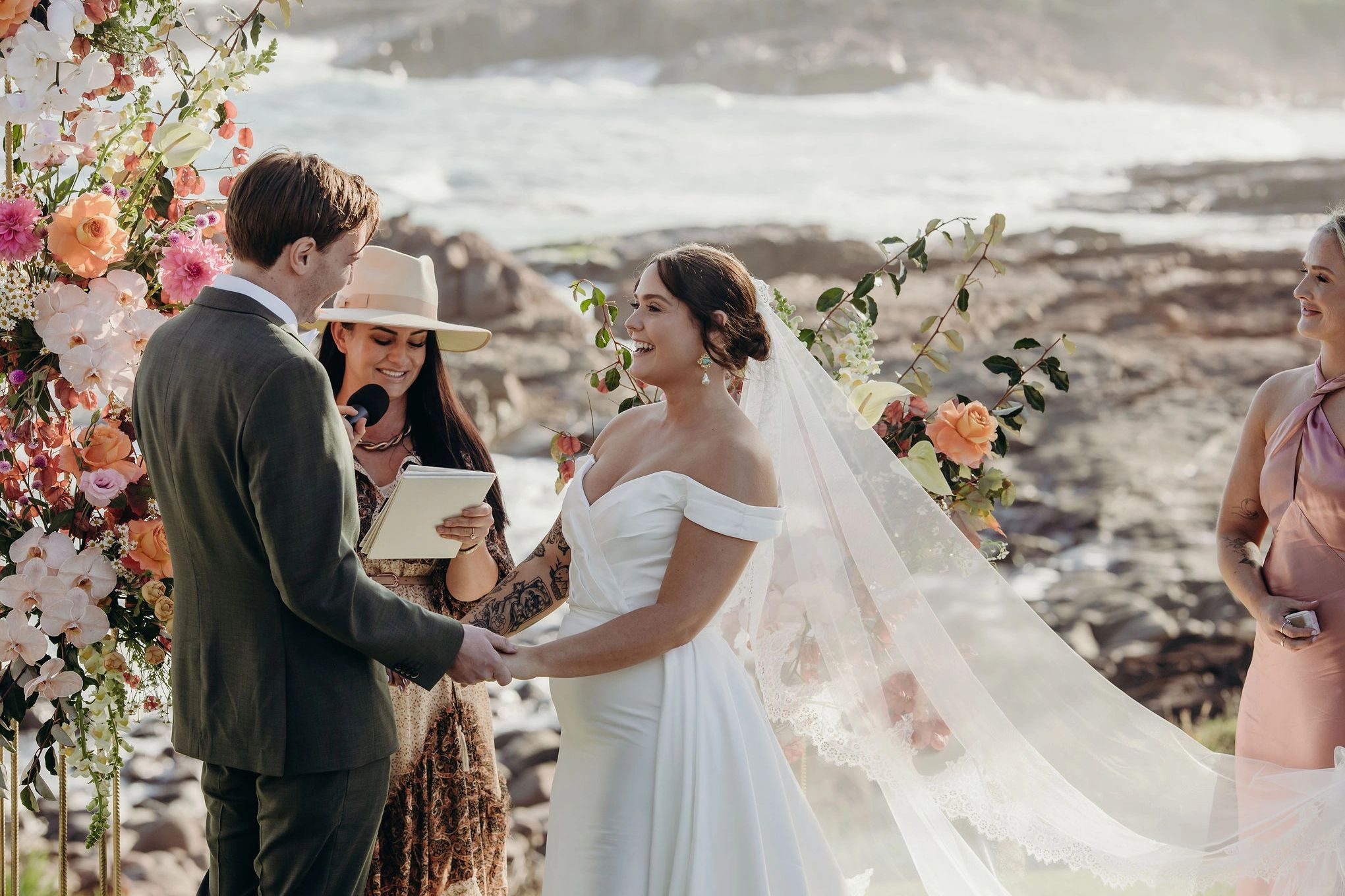 Celebrant shoal bay relaxed wedding couple by ocean 