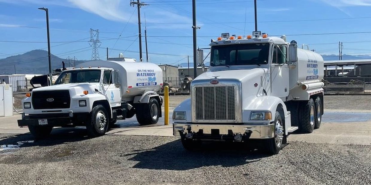 On The Move Water Boy bulk water delivery service Trucks parked in Medford, Oregon.