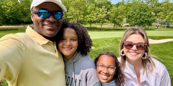 Jean with daughters Mia, Elle, and wife Jessica.