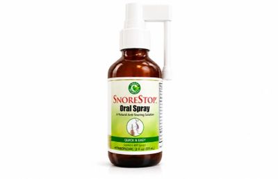 SnoreStop oral spray bottle for snoring relief with a spray nozzle.