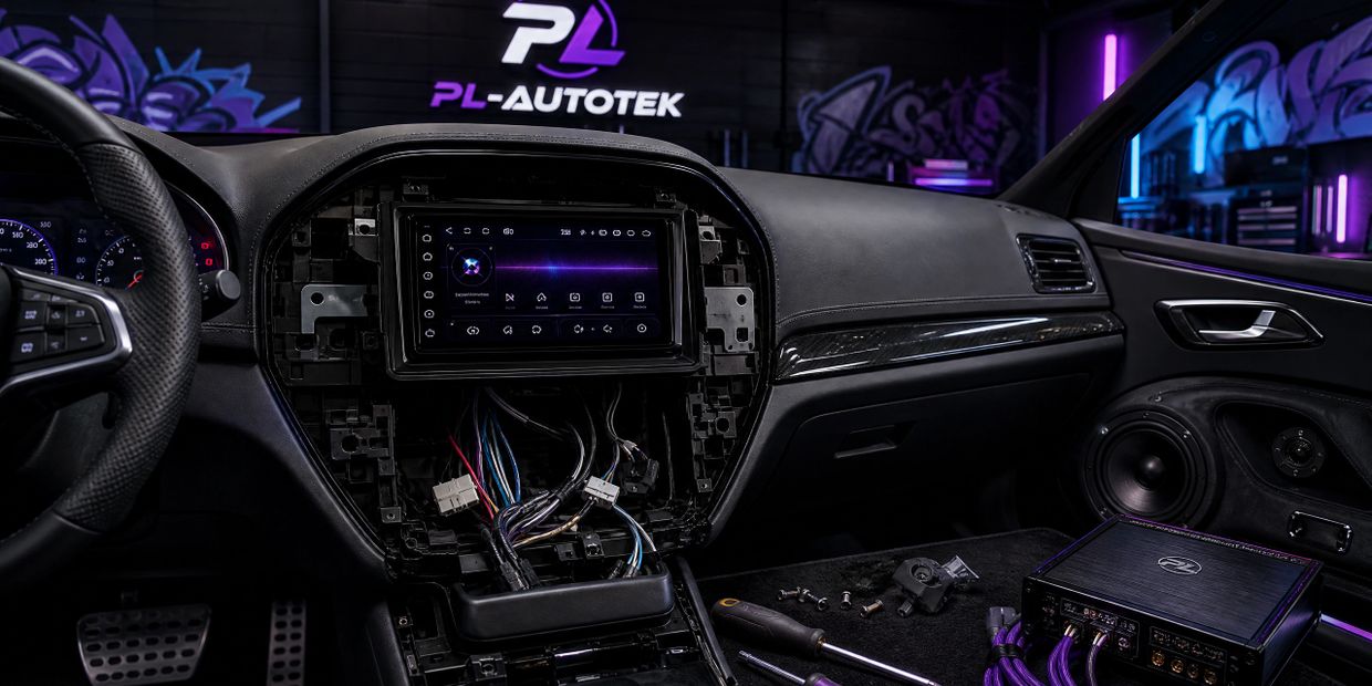 High-end car audio installation in progress, showing a modern head unit, wiring, and tools in a dark