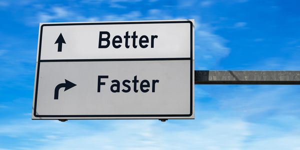 Road sign that has two signs, one reading "better" and one reading "faster"