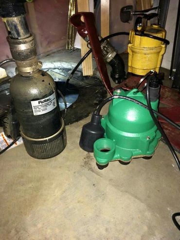 Showing a sump pump replacement in Edmonton by our journeyman plumbers. New sump pump installation.