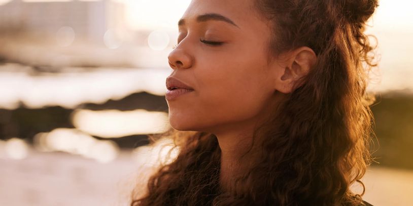 Female teen or pre-teen using breath work as a healthy coping skill to calm her stress and anxiety.