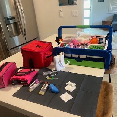 Medical supplies and equipment arranged on a kitchen island.