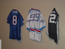 Realistic mural painting of team jerseys for a baby boy's nursery wall in Cypress, Texas. 