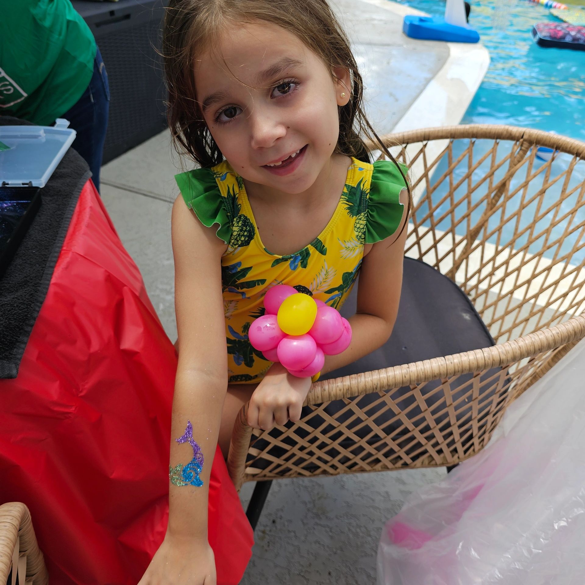 Mermaid glitter tattoo & balloon flower at neighborhood park from our Face Painter in Houston