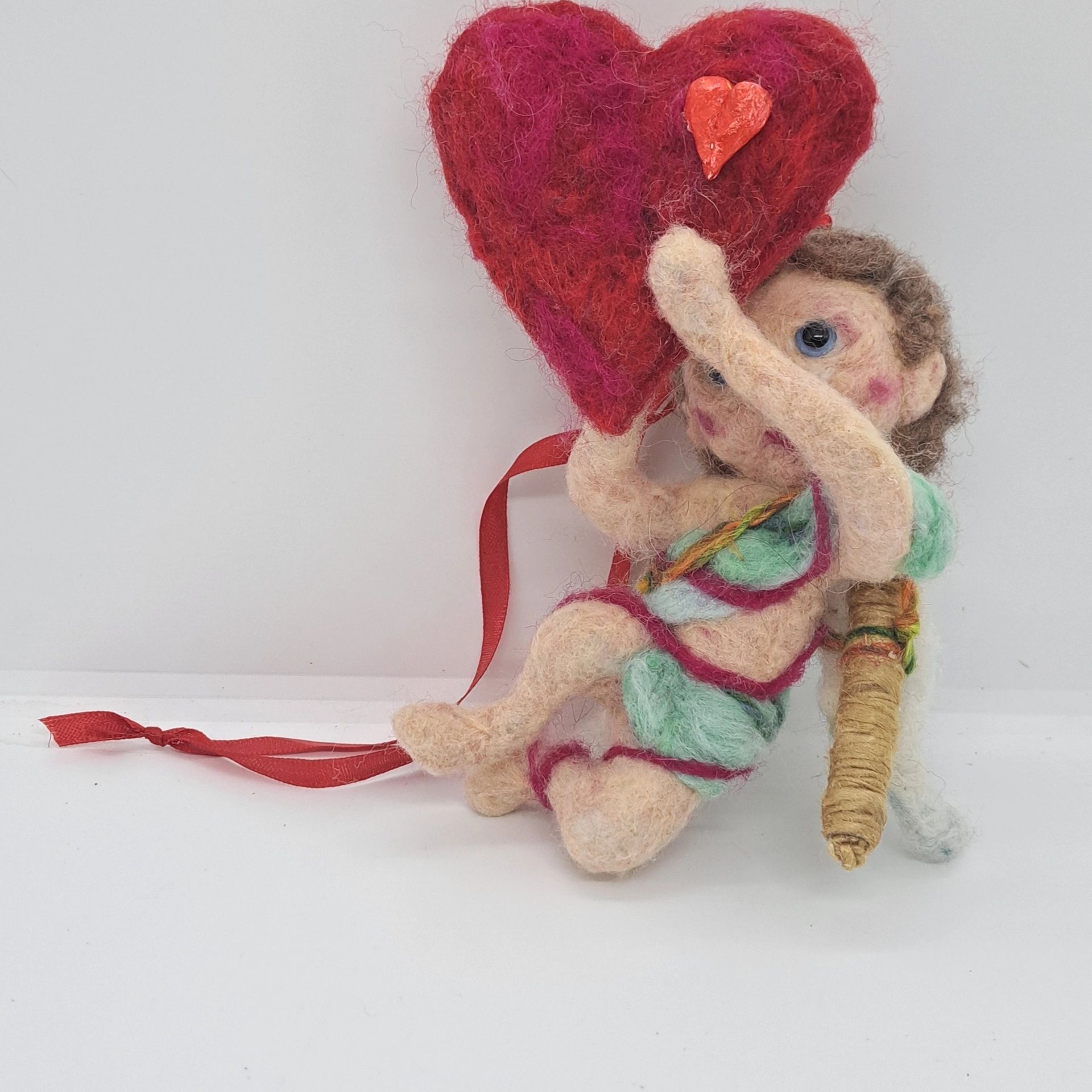 Valentine's Day cupid holding heart. Needle felt ornament. 