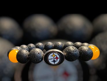 Black and yellow beaded bracelet with Steelers logo centerpiece.