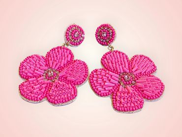 Bright pink beaded flower earrings with intricate detailing.