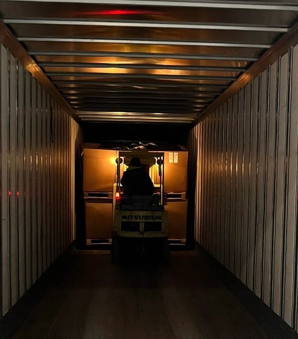 Cross Dock, unloading freight with forklift. Pallets 