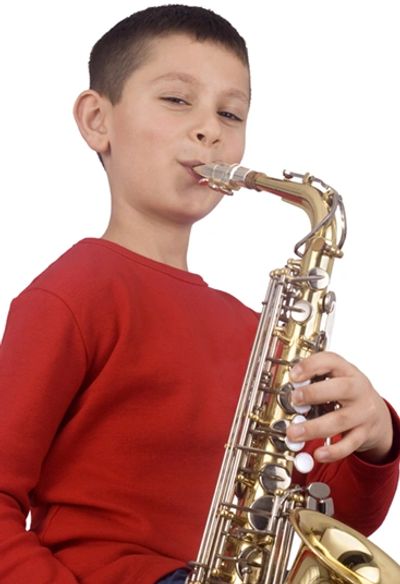 Boy learning to play the saxophone at the Norman Music Institute