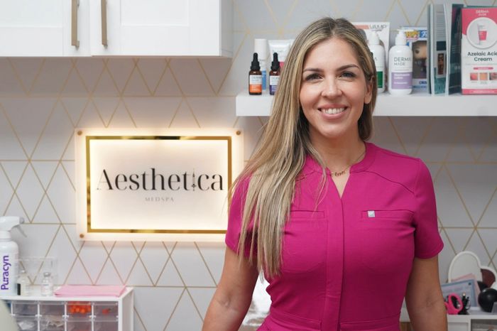 Cristy Monroe in pink scrubs at Aesthetica Medspa in Miami Lakes