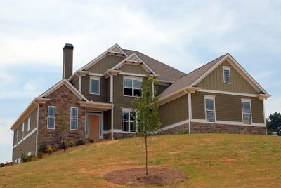 House on a hill with new residential caulking.