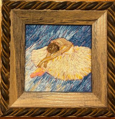 Impressionist painting of a ballerina resting in a wooden frame.