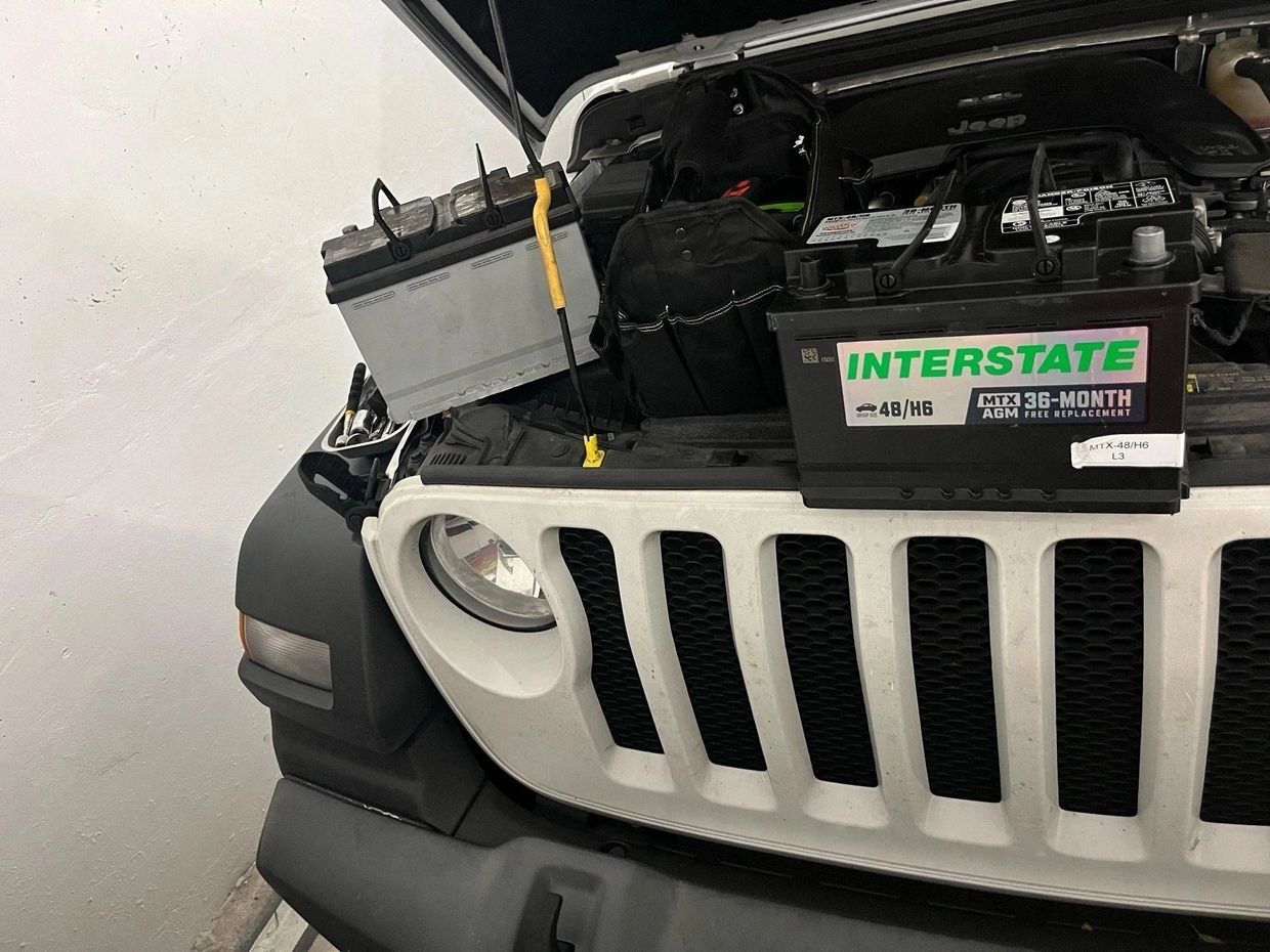 New Interstate car battery ready to be installed in a Jeep.