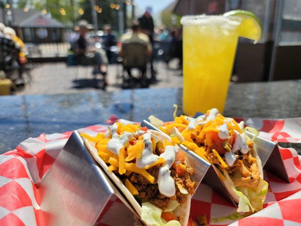 Gunselman's Tavern Beef tacos and margarita outside patio view 