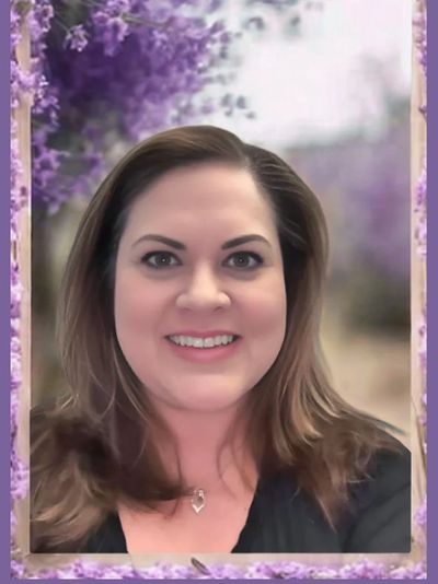 Head shot of Cara Putnam image evokes feelings of calm and whimsy has lavender border and background