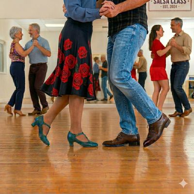 Couples dancing salsa in a lively studio with wooden floors.