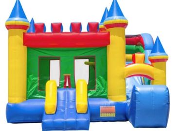 Colorful inflatable bounce house with castle design and slide.