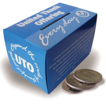 Blue United Thank Offering box with coins beside it.